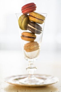 Macaroons inside drinking glass.