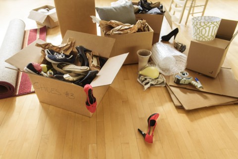 Cardboard boxes on wooden floor.