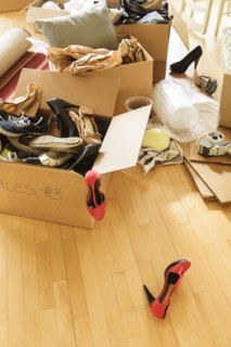 Cardboard boxes on wooden floor.
