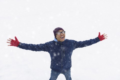 Mid adult man standing on snow.