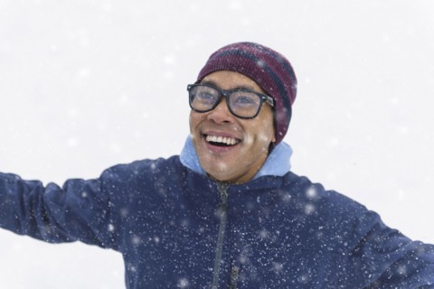 Mid adult man standing on snow.