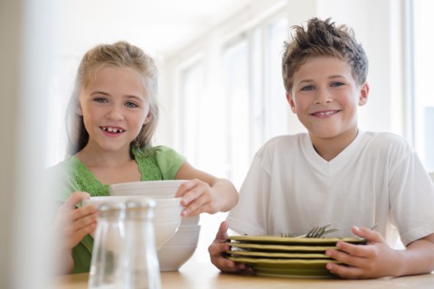 Brother and sister (6-7, 8-9) setting table