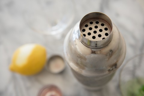 Cocktail in cocktail shaker on table
