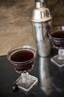 Alcohol in wine glass and cocktail shaker