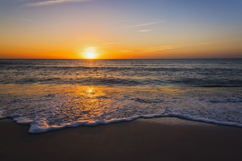 Beach and sea at sunset