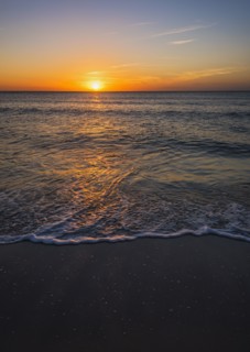 Beach and sea at sunset