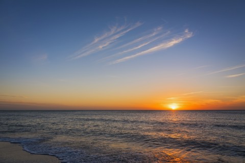 Beach and sea at sunset