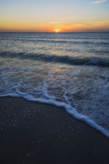Beach and sea at sunset