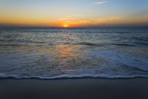 Beach and sea at sunset