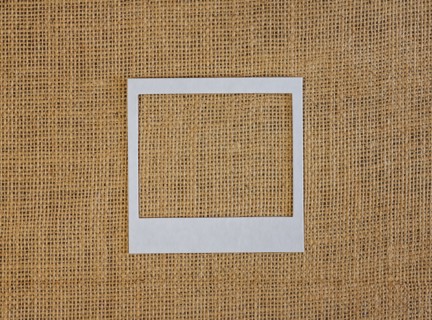 Studio shot of picture frame on fabric