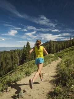 Mature woman running in mountains