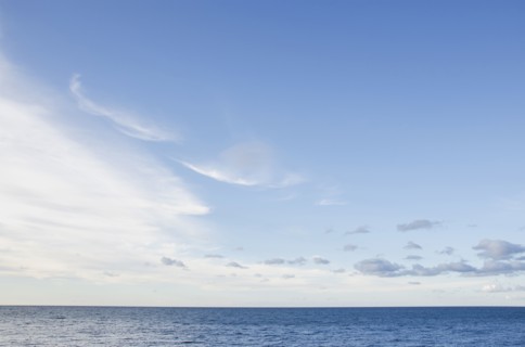 Sea with cloudy sky