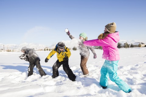 Children (8-9, 10-11) playing in snow