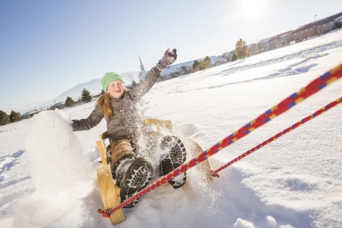 Children (8-9) riding sled