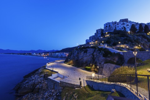 Town on rocky hills at sunrise