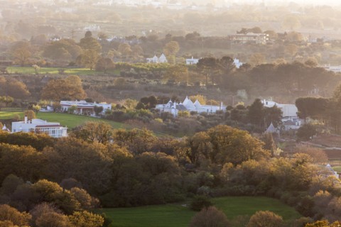 Landscape with trulli houses at sunset