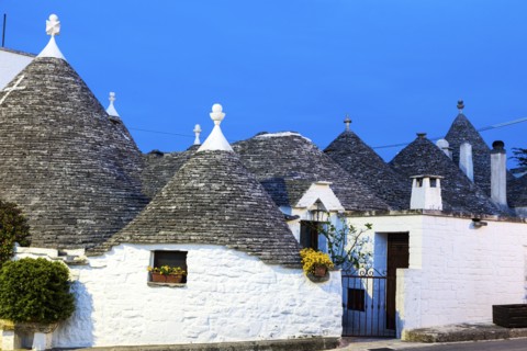 Trulli houses under blue sky