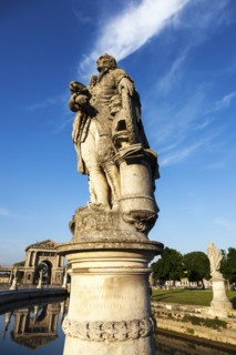 Statue on Prato della Valle under blue sky