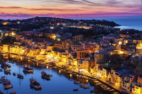 Illuminated townscape on Marina Corricella on Procida Island