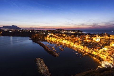 Illuminated townscape on Marina Corricella on Procida Island