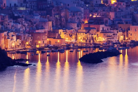 Illuminated townscape on Marina Corricella on Procida Island
