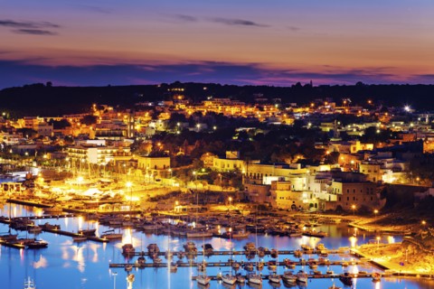 Illuminated townscape of Santa Maria di Leuca with marina in foreground