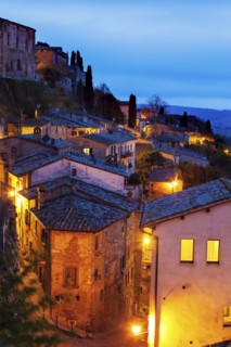 Montepulciano, Illuminated houses on rocks under cloudy sky