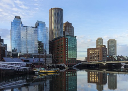 Waterfront buildings reflecting in water