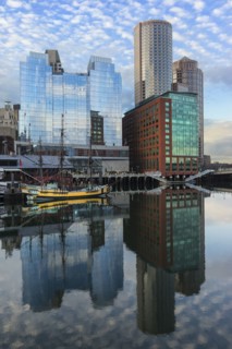 Waterfront buildings reflecting in water