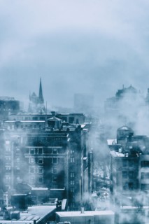 Steam above buildings in winter