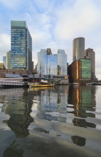 Waterfront buildings reflecting in water