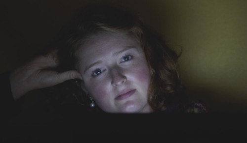 Woman with hand in hair