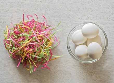 Eggs in bowl and colorful streamers