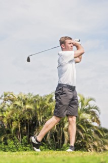 Man swinging golf club