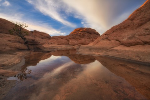 Sandstones reflected in water