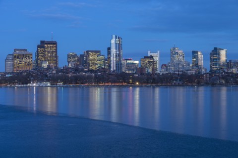 Charles river and illuminated downtown district at dusk