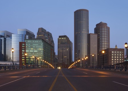Empty city street with financial district in background
