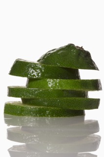 Slices of lime on white background