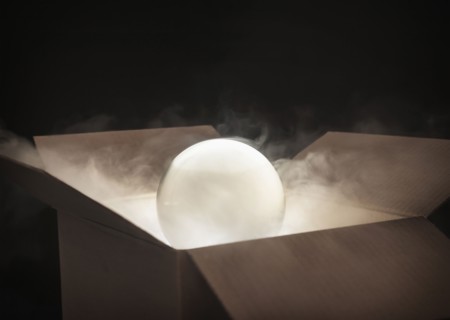 Crystal ball in cardboard box.