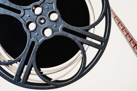 Film reel on white background.