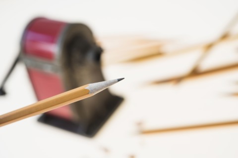 Pencil and antique pink pencil sharpener.