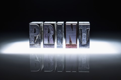 Word "PRINT" carved in blocks.