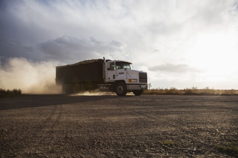Truck driving in field