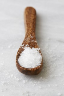 Wooden spoon with sea salt