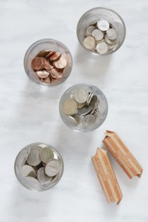 Overhead view of coins in glasses