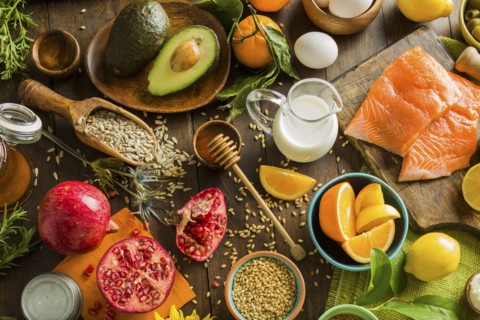 Overhead view of messy table with various fruits and seeds