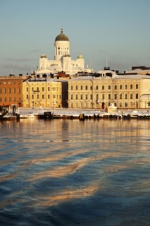 Finland, Helsinki, Harbor and cathedral at sunset