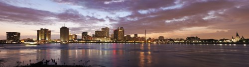 Louisiana, New Orleans, Mississippi river and city skyline with skyscrapers at sunset