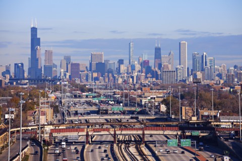 Illinois, Chicago, Urban scene with car traffic and skyscrapers in distance