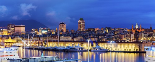 Italy, Liguria, Genoa, Panorama of harbor at dusk